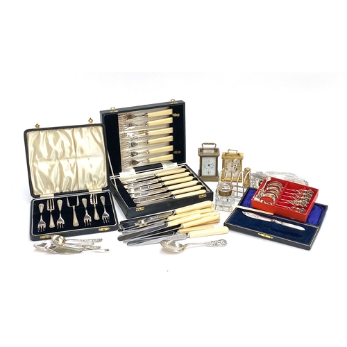 68 - A mixed lot of plated wares to include a 830s white metal spoon, several cased sets, resin handled s... 