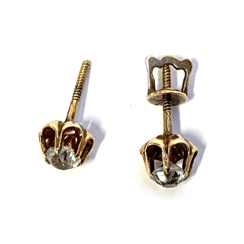 12 - A pair of gold stud earring claw set with old cut paste, one earring back missing, gross weight 1.2g