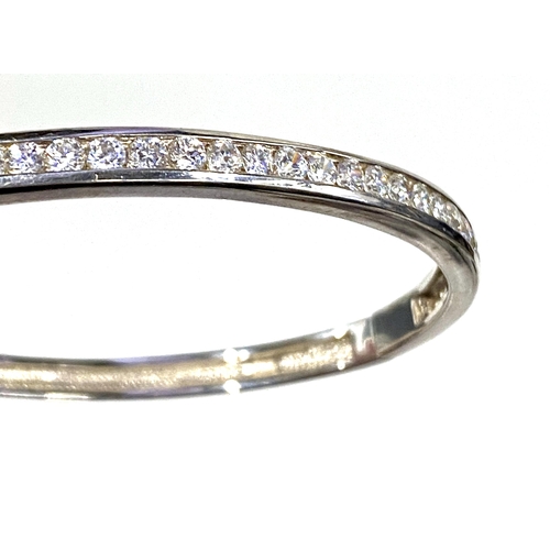 31 - A 925 silver bangle set with cubic zirconia, gross weight 19.9g