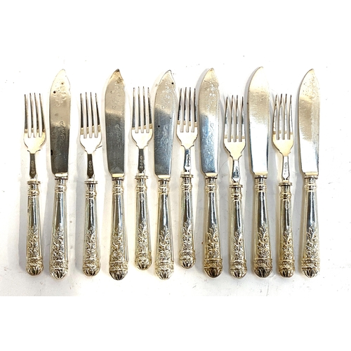 79 - A set of six white metal fish knives and forks, stamped