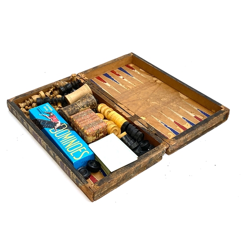 407 - A leather vintage backgammon/chess board, with pieces, in the form of two leather bound volumes of t... 