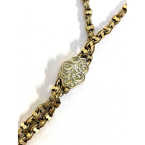 53 - An antique gold fancy link chain with engraved slider and tassel pendant, tests as 9ct or higher, 45... 