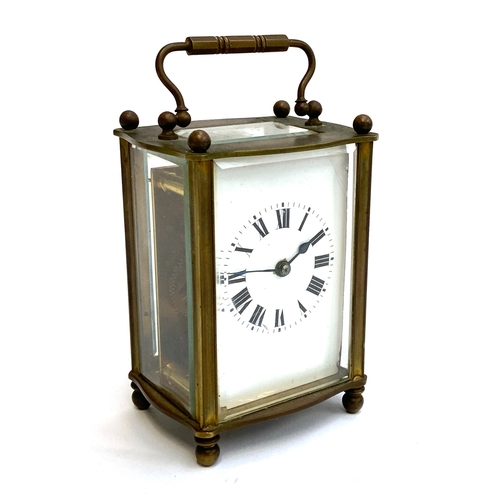 102 - CLOCK: A French made carriage timepiece, in working order, with ball-feet