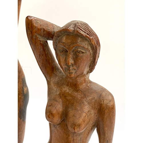 236 - Two 20th century female nude studies in carved wood, 40cmH and 31.5cmH