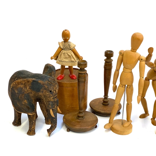 237 - A quantity of wooden items, to include artists models, abstract 'Thinker' figure, carved elephant, t... 