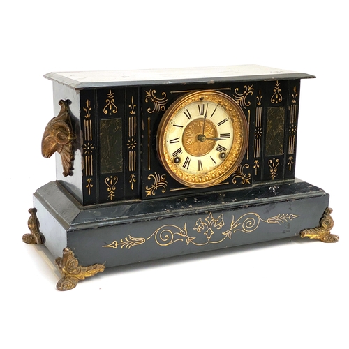 118 - A large black painted metal mantel clock with gilt metal fittings and applied Ram masks; manufacture... 