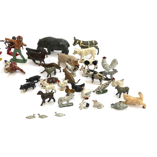 315 - A quantity of vintage metal die cast figurines to include cowboys and Indians, farm animals  includi... 