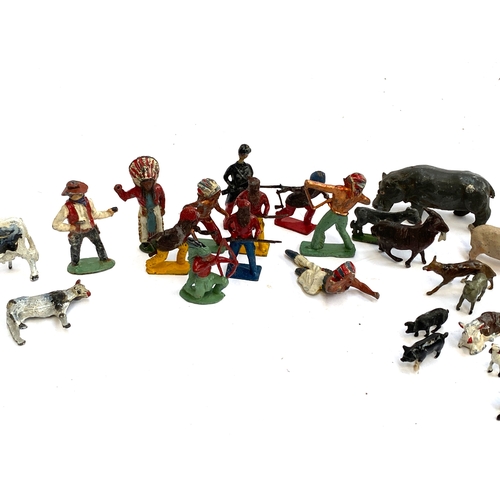 315 - A quantity of vintage metal die cast figurines to include cowboys and Indians, farm animals  includi... 