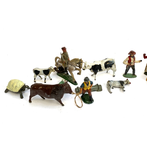 315 - A quantity of vintage metal die cast figurines to include cowboys and Indians, farm animals  includi... 