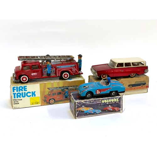 320 - Three boxed vintage toy cars/vehicles, all made in China, 'Travelling Car', tin plate 'Racer' and ti... 