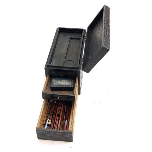 326 - A small Japanese Suzuribako calligraphy writing box, with metal mounts, the hinged top over two draw... 