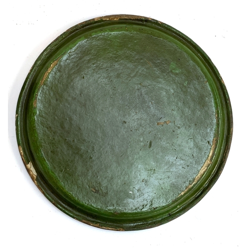 328 - A green painted papier mache circular tray with hand painted floral spray decoration, 29cmD