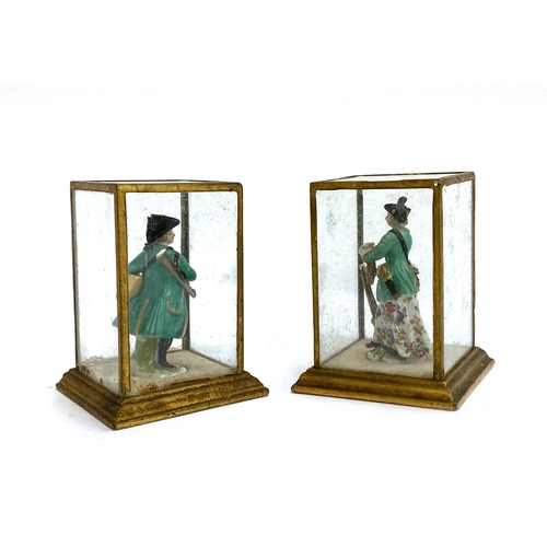 168 - A pair of 19th century continental Meissen style miniature porcelain figures of a huntsman and compa... 