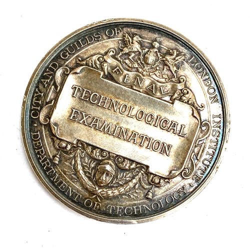 72 - An early 20th century silver medallion for City and Guilds Of London Institute Department of Technol... 