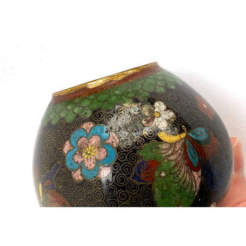 183 - A Chinese cloisonne enamel lidded circular pot, green ground with red and white flowers, 10.5cmD; to... 