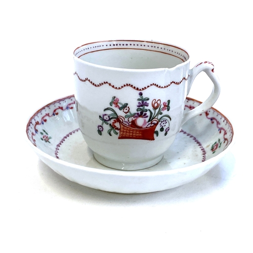 186 - An 18th century cup and saucer, pink floral decoration, together with a further 18th century trio, c... 