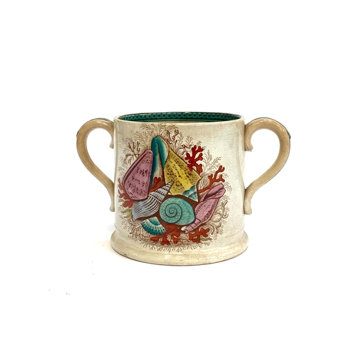 135 - A large Victorian twin handled lovers mug with a transfer ware seashell and coral pattern, 12cmH