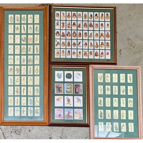 714 - A large quantity of framed and glazed cigarette cards to include Player's Dickens, Cats, Thackeray, ... 