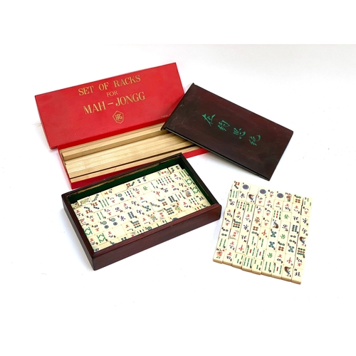 342 - An early 20th century mahjong set, bone and bamboo pieces, together with a set of racks, 152 pieces