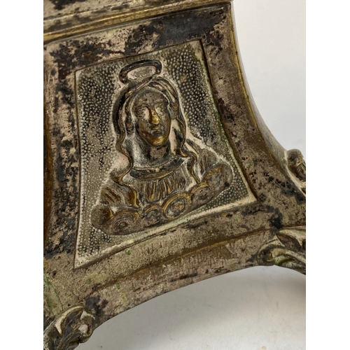 356 - A pair of altar candlesticks (one loose), each side of the triform base depicting Mary, Jesus, and a... 