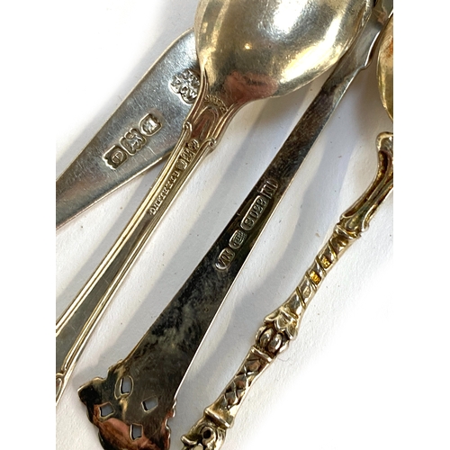 77 - Four silver teaspoons to include 800, 830, and sterling; one with edelweiss flower terminal, gross w... 