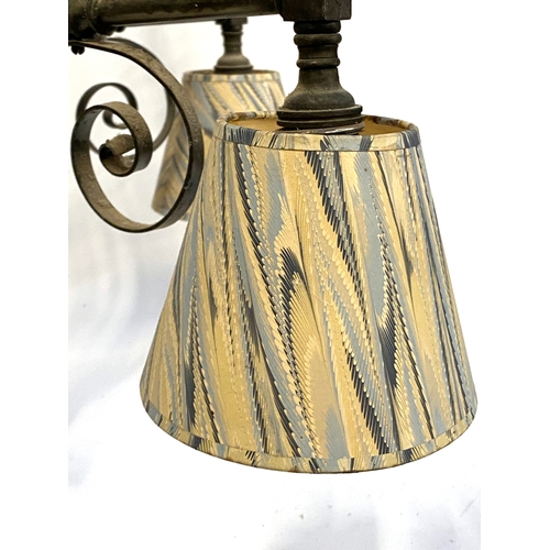 377 - A large wrought metal five armed chandelier with applied metal swirl detail and marbled paper style ... 