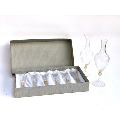 224 - A box set of six La murrina flutes 22cmH, together with two decanters 36cmH