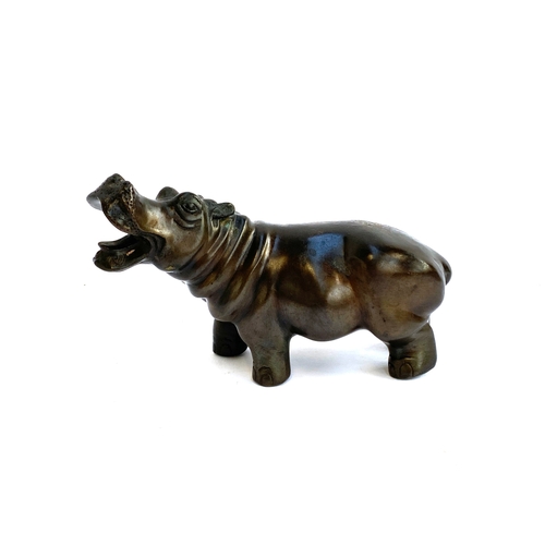 407 - A bronze figure of a hippo 20cmL together with two Balinese carved wooden tigers 32cmL/20cmL and a c... 