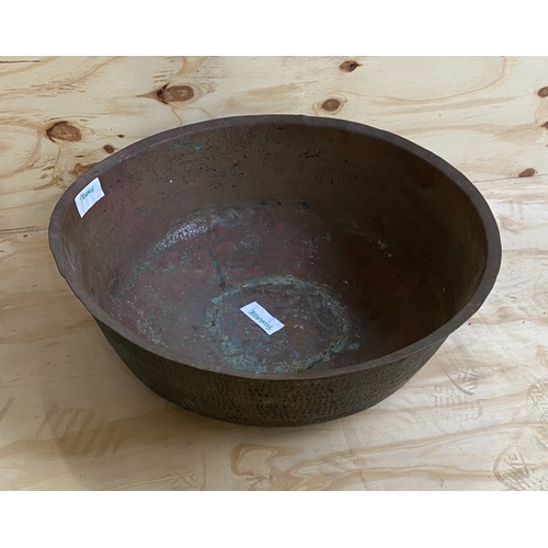 916 - A large beaten copper bowl, approx 70cmD