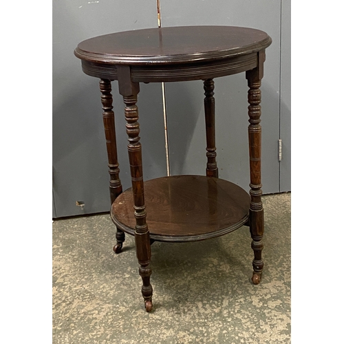 919 - A late Victorian circular rosewood lamp table, on turned legs and undershelf, 53x70cm