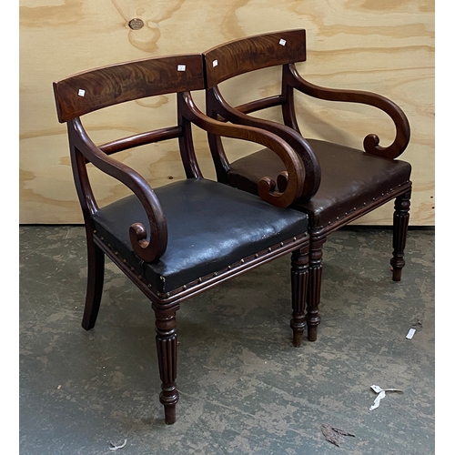 915 - A pair of 19th century mahogany open armchairs with leather stuff over upholstered seats on reeded t... 