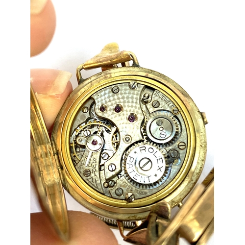 119 - A 9ct gold cased early 20th century Rolex watch (af), the movement marked 'Rolex Patent, 15 jewels, ... 