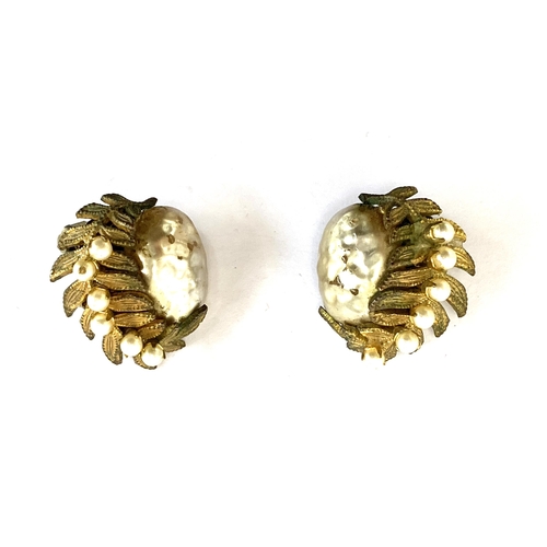 35 - A pair of vintage Miriam Haskell faux pearl and gilt metal fern leaf clip on earrings, marked to cli... 