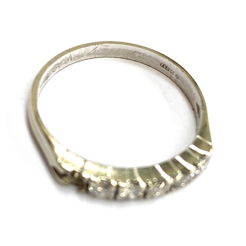 47 - An 18ct white gold and diamond half eternity ring (one diamond missing), size N 1/2, 2.1g