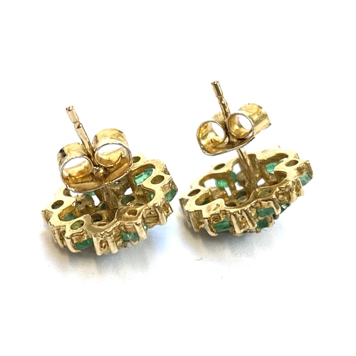 50 - A pair of 9ct gold, emerald and diamond floral cluster stud earrings, 1.4cm diameter, gross weight 2... 