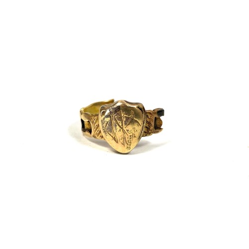 24 - A Victorian yellow metal scrap ring with shield engraved with monogram (af), 1.3g