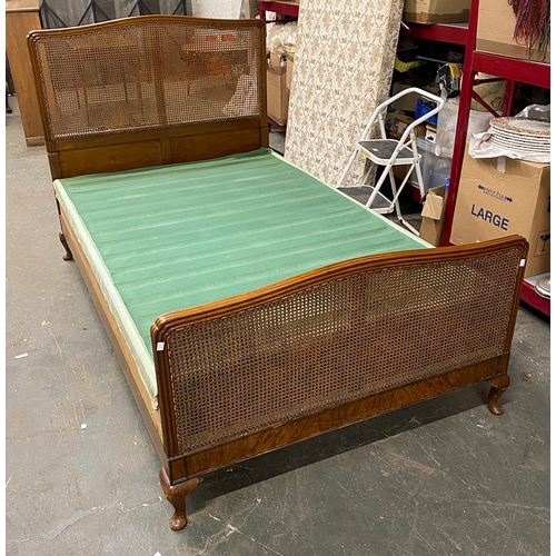 1060 - A small double bed with caned head and double caned foot, 123cm wide, the head 123cmH, the foot 73cm... 