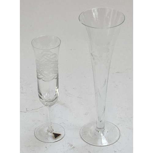 428 - Four boxes of engraved lead crystal glass champagne flutes (24) 20cmH together with four more boxes ... 