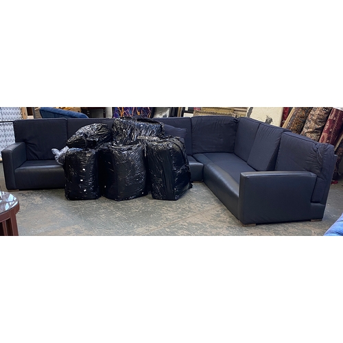 1064 - A very large black leather and fabric upholstered contemporary corner sofa