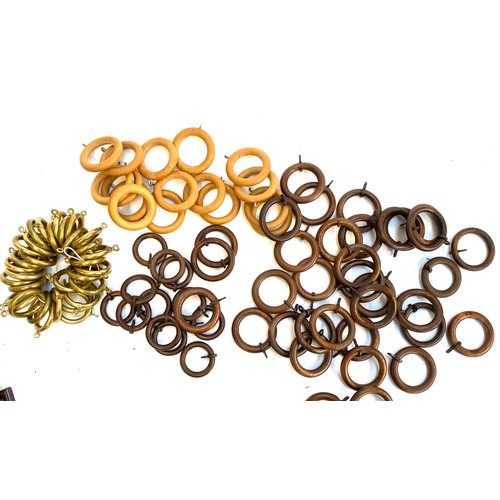 284A - A quantity of curtain rings: brass 4cmD internal diameter (32), light wood 4.5cmD diameter (16), and... 