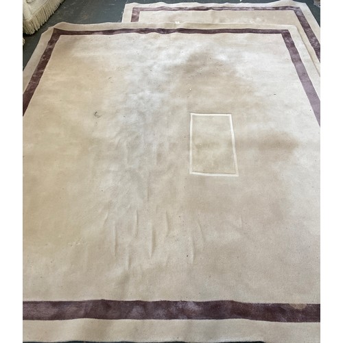 1069 - Two large modern cream rugs with single borders, 230x250cm and 325x285cm