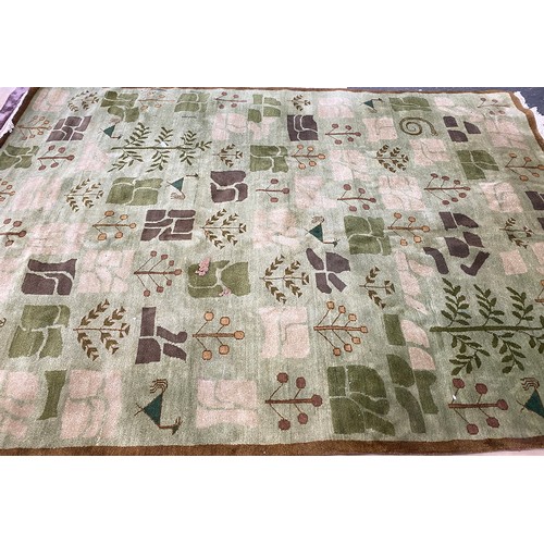 1070 - A large green wool rug, 250x350cm