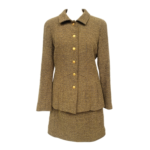 245 - A Chanel Boutique fitted tweed jacket and skirt suit set, in yellow, cream, and brown tones, with si... 
