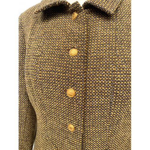 245 - A Chanel Boutique fitted tweed jacket and skirt suit set, in yellow, cream, and brown tones, with si... 