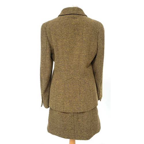 245 - A Chanel Boutique fitted tweed jacket and skirt suit set, in yellow, cream, and brown tones, with si... 