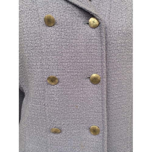 247 - A powder blue Chanel boucle wool suit set, double breasted jacket with weighted chain lined hem, sil... 