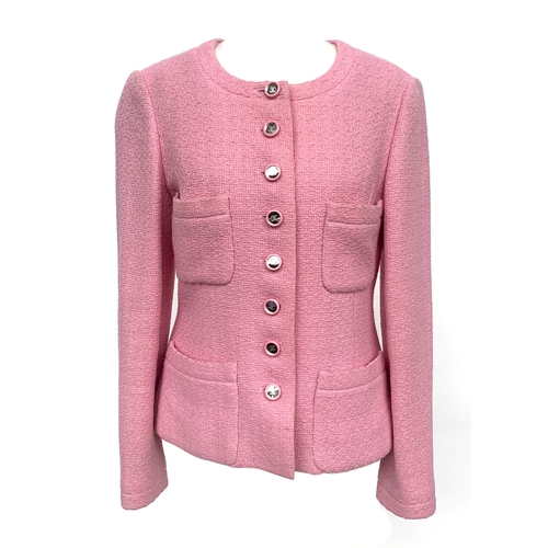 248 - A pink Chanel jacket in boucle tweed, with CC monogram buttons, collarless round neck, four patch po...