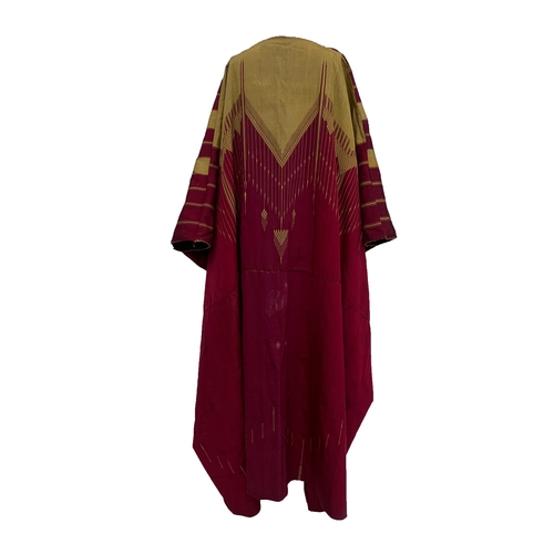 763 - A c.1900 burgundy and gold cotton Abaya with geometric gold braid and woven design, 51