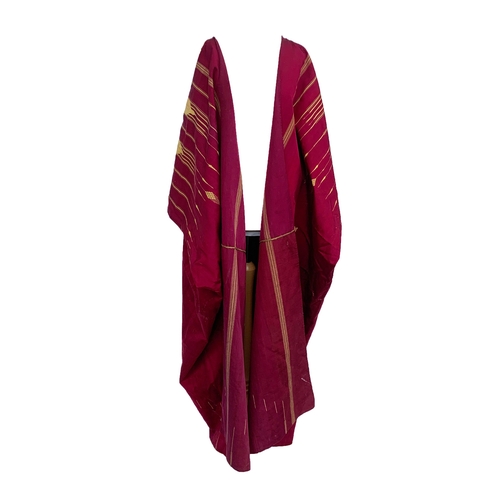 763 - A c.1900 burgundy and gold cotton Abaya with geometric gold braid and woven design, 51