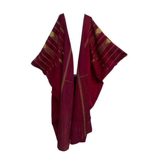 763 - A c.1900 burgundy and gold cotton Abaya with geometric gold braid and woven design, 51